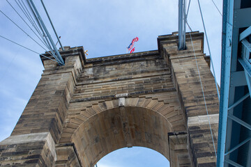 Fototapeta premium View of one of the towers of the Roebling Suspension Bridge while closed for repairs in April 2019 due to sandstone particles falling from one of the towers.