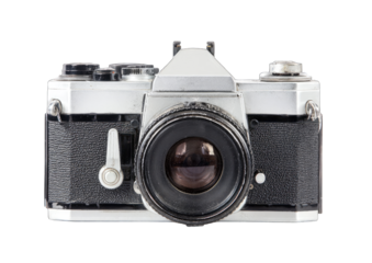 Front view of a vintage 35mm SLR camera.  A silver and black camera with a large lens and various controls.  Lens has a dirty or scratched appearance.  Image isolated on black background