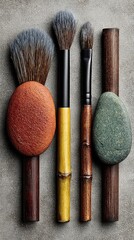 Four paintbrushes with natural stone bases