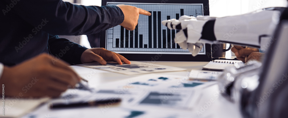 Poster a business team engages in a meeting, analyzing data presented on a digital screen, highlighting col