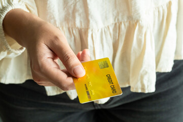 Woman holding several credit cards and he is choosing a credit card to pay and spend Payment for goods via credit card. Finance and banking concept	
