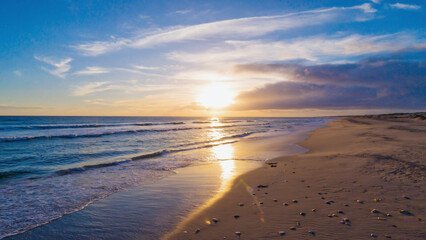 Beach coast with sunrise background. Ai generated.