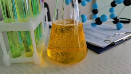 Colorful chemical reaction in laboratory flask with test tubes and molecular