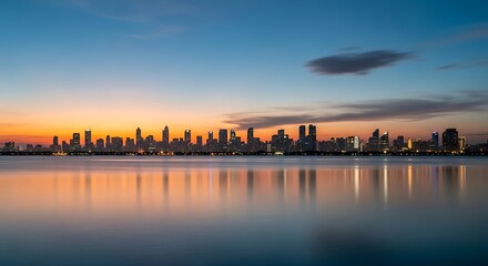 Fototapeta premium Vibrant City Skyline Reflected in Calm Water at Dusk with Colorful Sunset Sky