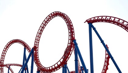 Roller coaster track loops against white sky