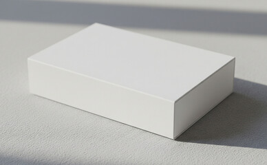 Fototapeta premium Blank Packaging Box On Textured Surface With Soft Shadows