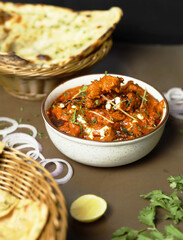 Butter chicken served with Homemade Indian Naan Bread Murgh Makhani