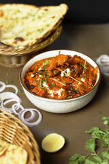 Butter chicken served with Homemade Indian Naan Bread Murgh Makhani