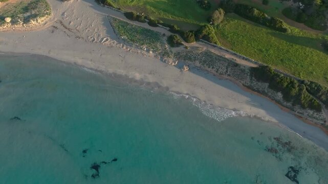 Aerial fly turquoise water of Menorca, Tranquil Shores of Binigaus beach, Spain travel destination