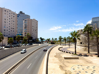 Obraz premium Aerial Bird's eye view of Albanian city Durres. Buildings and beach along Adriatic sea coast.