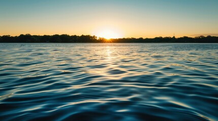 Fototapeta premium Sunset Reflection on a Calm Lake with Distant Hills