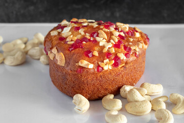 Heart shaped cake garnished with dry fruits