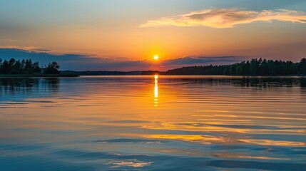 Fototapeta premium Sunset Reflection on a Calm Lake with Distant Hills
