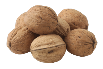 Close-up of a cluster of whole walnuts.  A group of walnuts, light brown in color, are tightly clustered together against a plain black background.  The shells have a rough, textured appearance