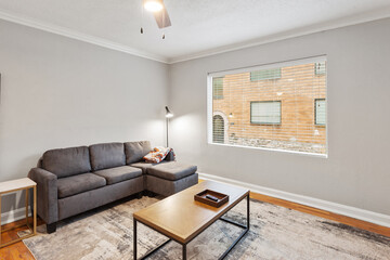 Bright living room interior in modern apartment with large windows
Clean white kitchen with stainless appliances in contemporary condo