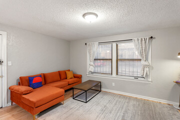 Bright living room interior in modern apartment with large windows
Clean white kitchen with stainless appliances in contemporary condo