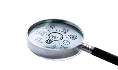 Magnifying glass focused on a lightbulb and other icons