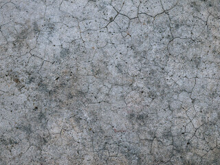 Cracked polished cement surface texture with natural imperfections.