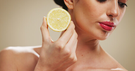 Beauty, woman and skincare with lemon, studio background or natural cosmetic for anti aging...
