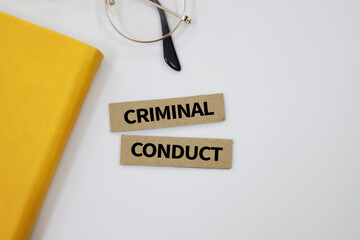 Magnifying glass with the word Criminal conduct. actions that violate the law and can be punished by the legal system. conduct that breaks a law where a criminal penalty can apply