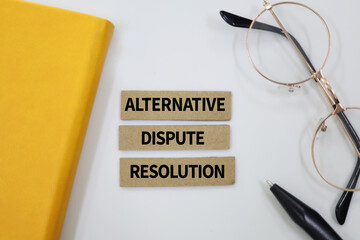 Paper arranged with the words Alternative Dispute Resolution. the term used to describe ways of...