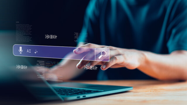 Artificial intelligence search bar interface with laptop and human hand, symbolizing AI technology, voice assistant, data innovation, and digital transformation in online search and smart solutions. - Powered by Adobe