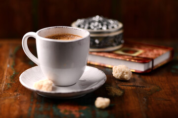 Cup of coffee on wooden background. Soft focus. Copy space	