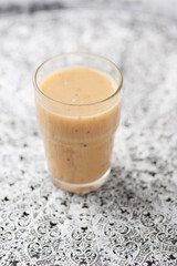 Pineapple coconut smoothie on bright background. Soft focus. Copy space.	