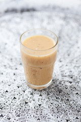 Pineapple coconut smoothie on bright background. Soft focus. Copy space.	