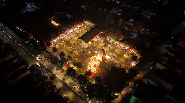 Aerial view of durga pooja event with temple  people gathering 