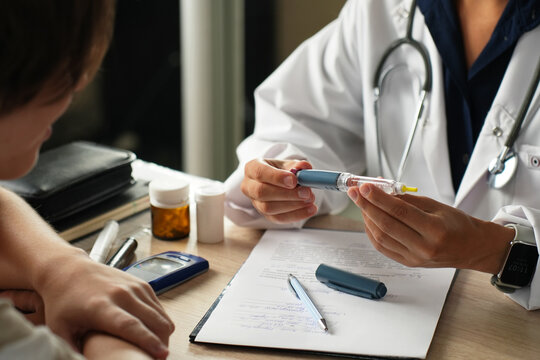 Doctor Explaining How to Use an Insulin Pen