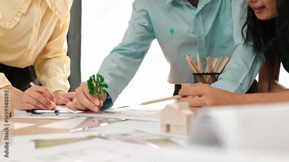 Poster architect and safety engineer discuss about position of tree use blueprint, model on table with arch