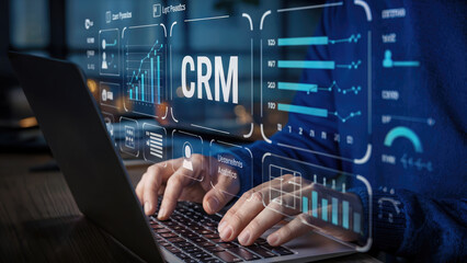Analyzing CRM data on laptop screen, exploring sales analytics for business growth strategies