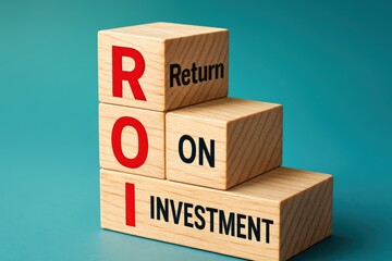 Stacked wooden blocks spell out Return On Investment, symbolizing financial growth and illustrating potential gains with tangible, positive economic forecast.