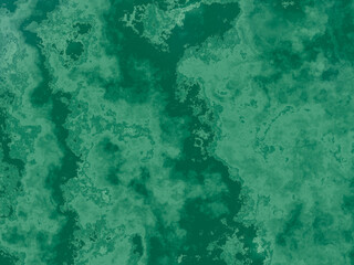 Rich green marble texture with deep veins and cloudy overlays.