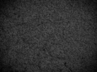 Dark granite texture with rich veins and natural patterns, ideal for design backgrounds.