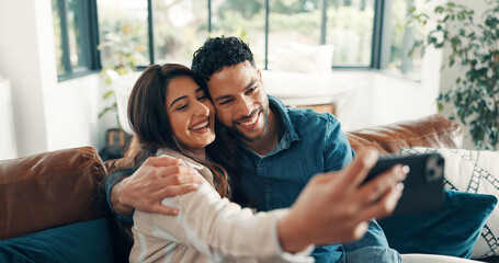 Selfie, smile and couple on sofa, love and bonding together with happiness, memory and...