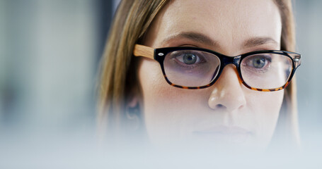 Face, glasses and reading with business woman in office to review online information for report....