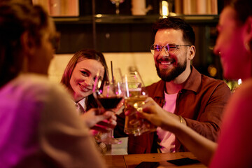 Group of Friends Celebrating Together with Drinks in a Relaxed Evening Setting