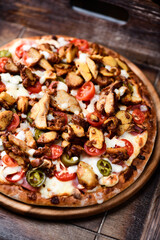 Gyros Pizza with jalapeno pepper, cherry tomatoes and mozzarella cheese. Soft focus. Close up.	