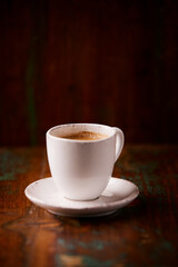 Cup of coffee on wooden background. Soft focus. Copy space	