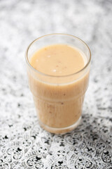 Pineapple coconut smoothie on bright background. Soft focus. Copy space.	