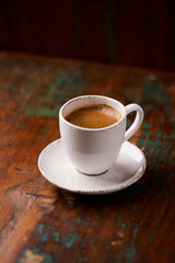 Cup of coffee on wooden background. Soft focus. Copy space	