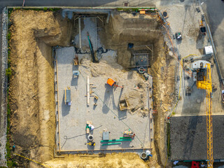 Aerial view of construction site in Switzerland. Crane for building a new house.