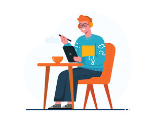 Happy young male digital artist or graphic designer drawing on a graphics tablet with a stylus, listening to music on headphones.