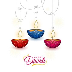 Naklejka premium Three colorful decorative diyas illuminated with golden flames on a white background with happy diwali text