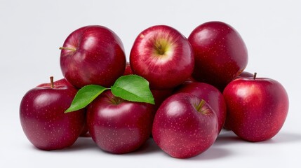 Fresh red apples stacked neatly on a bright background. Their vibrant color catches the eye. Perfect for food photography and healthy living themes. Ideal for various projects. AI