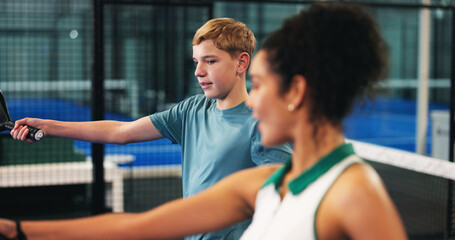 Coach, padel and woman with child on court for learning sports skills, training and exercise....