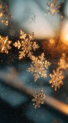 Delicate snowflakes sparkle on a window as warm sunlight creates a golden glow during sunset
