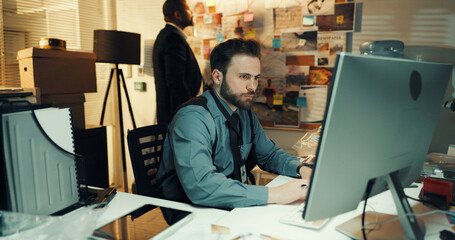 Man, detective or research on computer at night for reading evidence, problem solving or case...